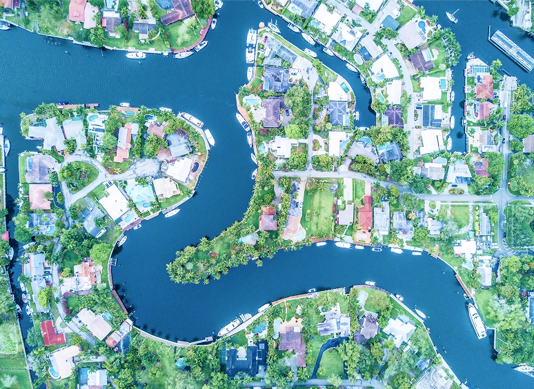 aerial view of community with water